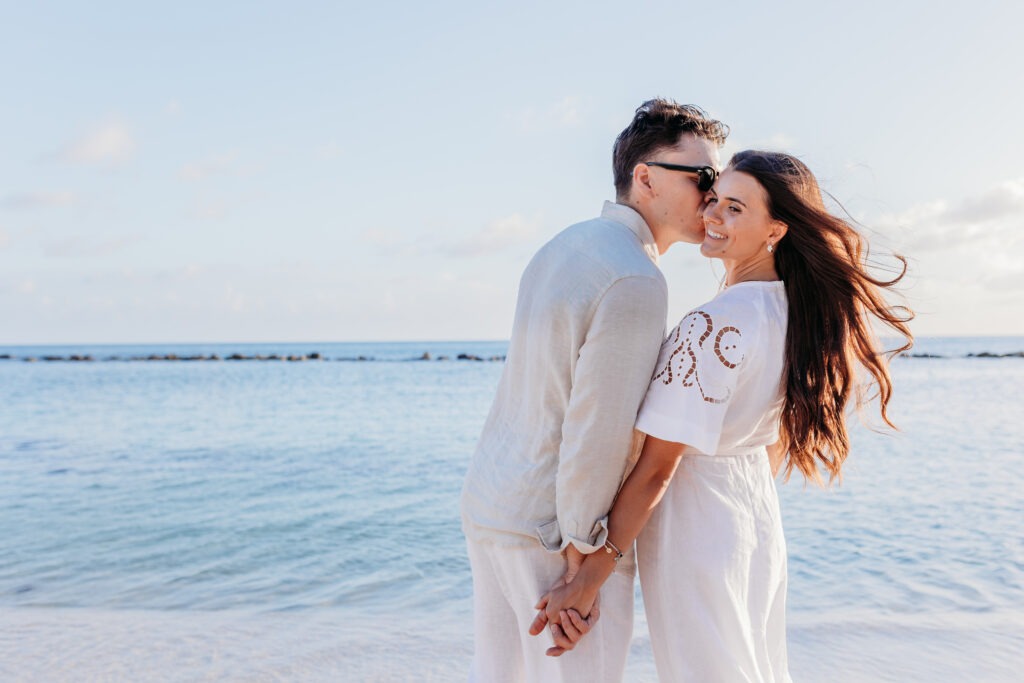 Romantic sunset engagement portrait session near palm trees in La Romana