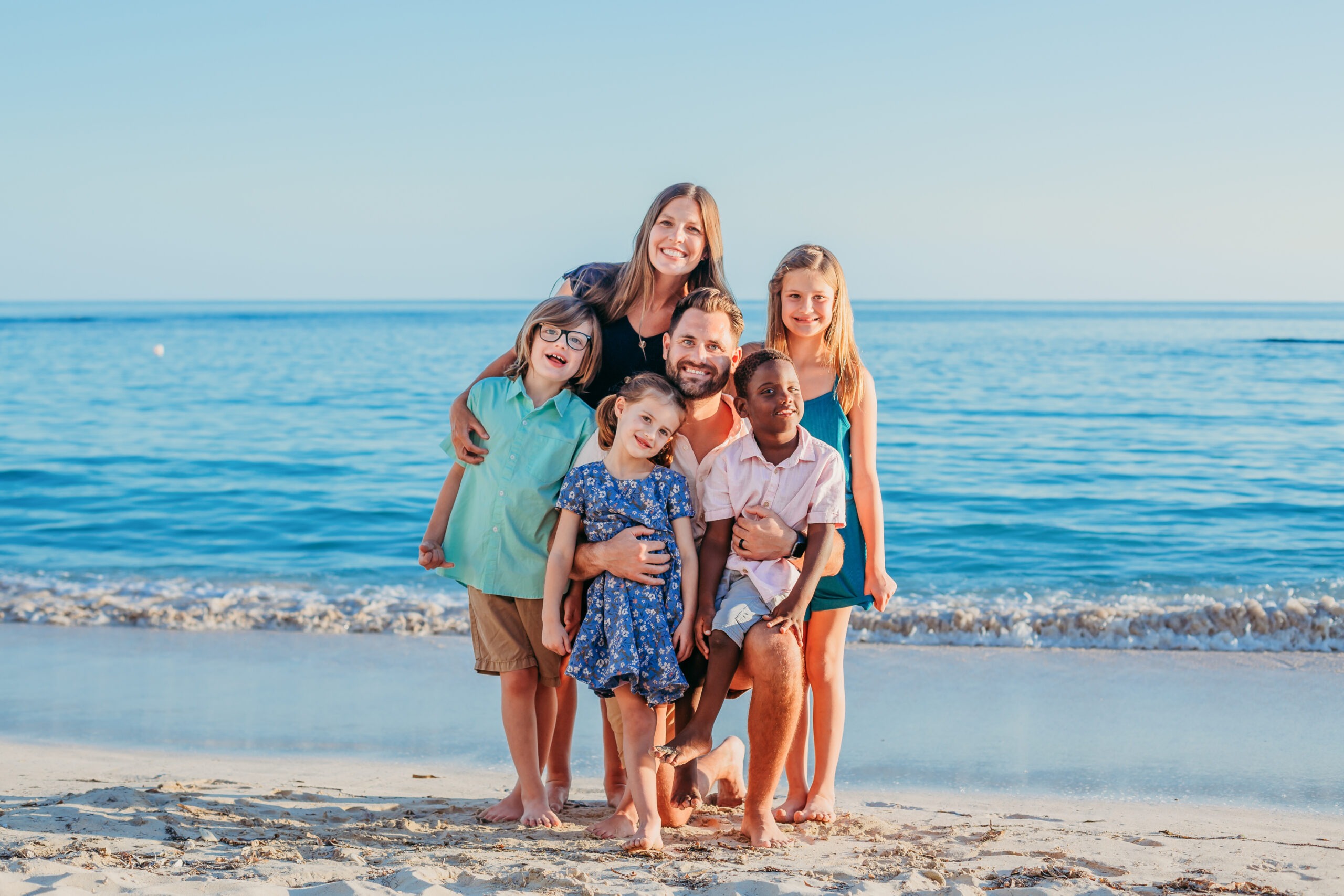 Family posing together on beach in Juan Dolio