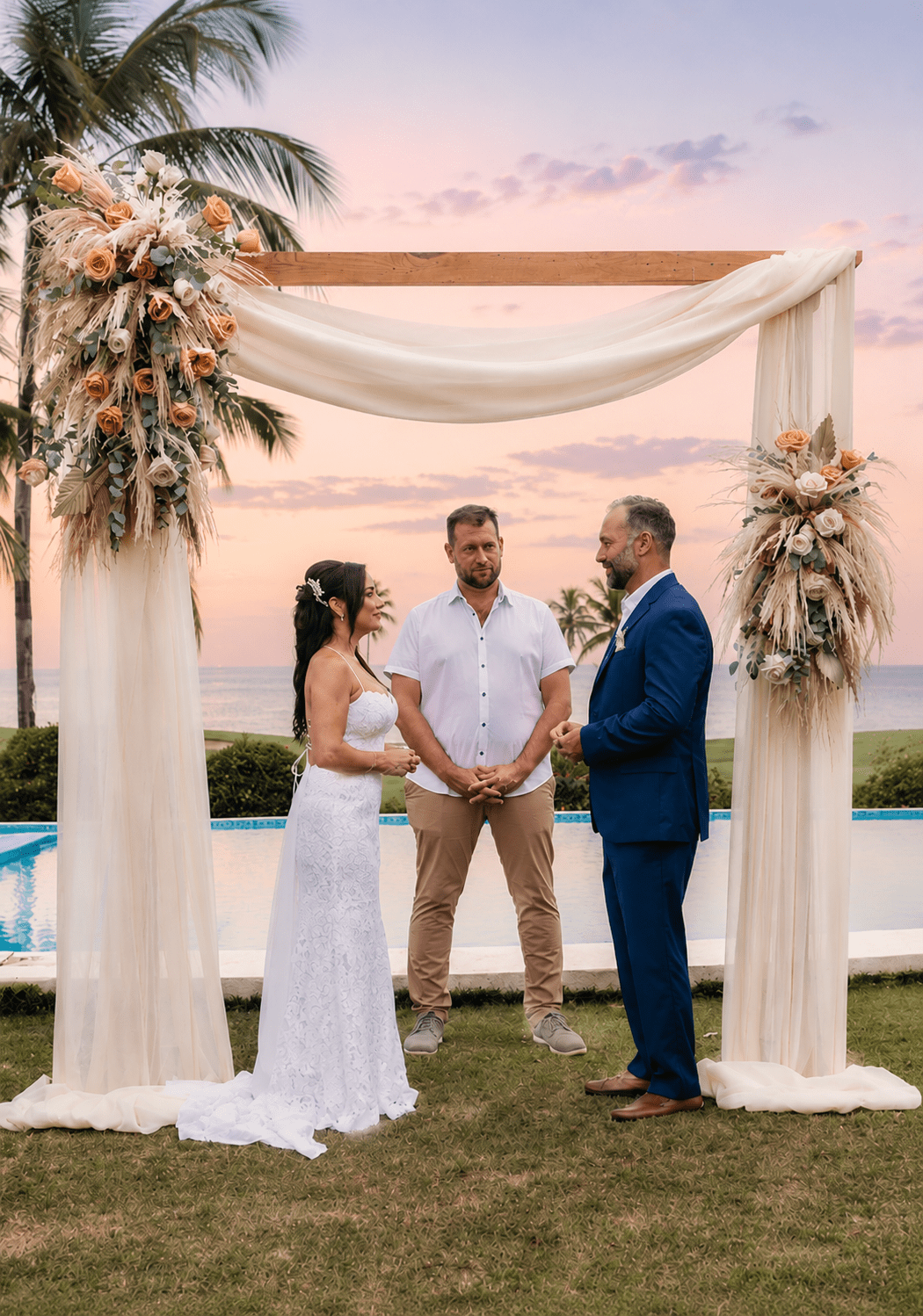 Bride and groom exchanging vows under a floral wooden arch during an intimate private villa ceremony at sunset in Casa de Campo, captured by a La Romana photographer in the Dominican Republic.