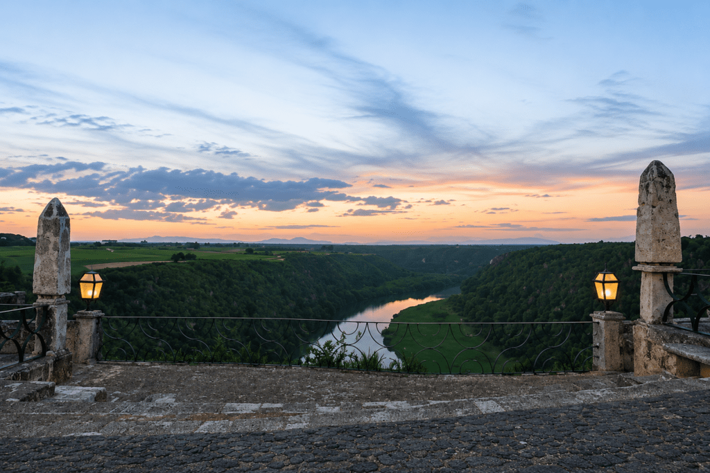 Panoramic sunset view over the Chavón River valley from the historic stone balcony in Altos de Chavón, Casa de Campo, photographed by a La Romana photographer