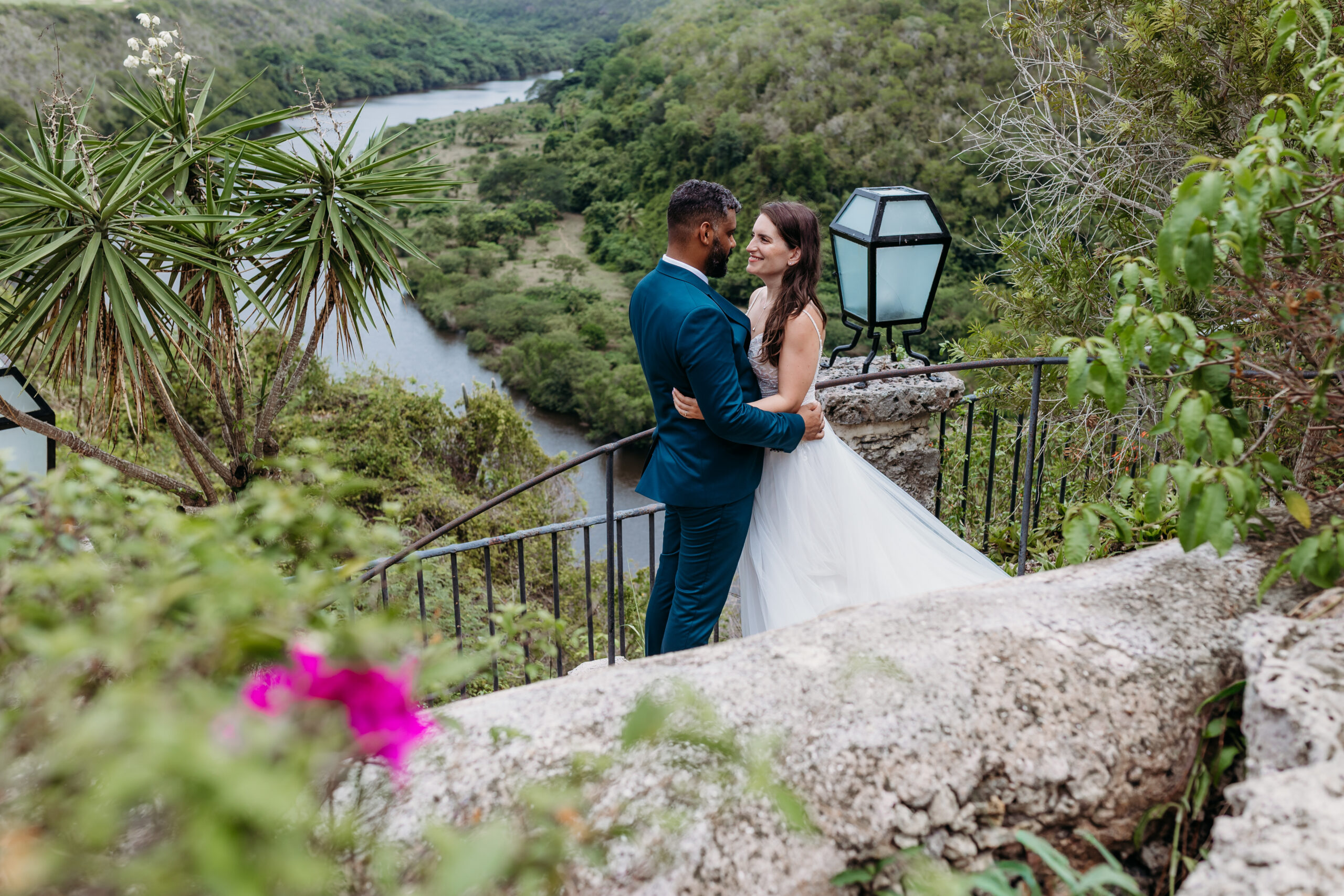 Bride and groom during a post-wedding photoshoot overlooking the Chavón River at Altos de Chavón, Casa de Campo, La Romana.